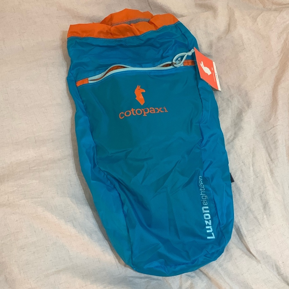 Cotopaxi Luzon 18L backpack in turquoise and orange